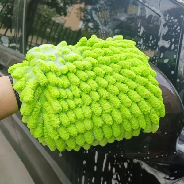 Green car wash mitt in use cleaning car paint, scratch-free and swirl-free