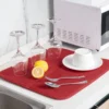 Kitchen countertop drying mat protecting marble surface from scratches and water damage