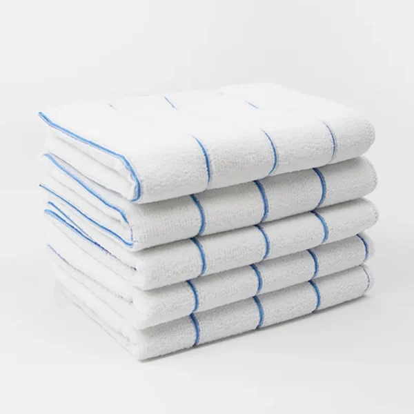 Microfiber kitchen towel absorbing water, 6x its weight in seconds